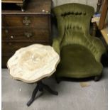 A Victorian button back salon elbow chair on turned front legs,