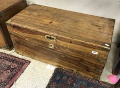 A 19th Century camphor wood trunk with brass corners and embellishments