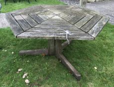 A hexagonal wooden garden table