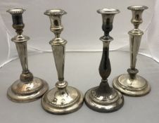 A pair of 19th Century plated candlesticks of circular tapered form,