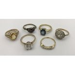 Six 9 carat gold stone set rings,