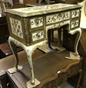 An Italianate gilded and painted side table on cabriole legs