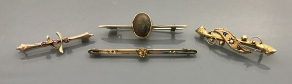 Four various gold bar brooches in the Victorian taste to include a black opal