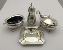 A modern silver three piece cruet (Birmingham 1979), together with an ashtray (Birmingham 1979),