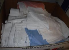 A box containing assorted table linens