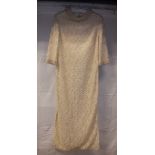 A mid-20th Century cream dress with pearl decoration by Ellis of London, size 12,