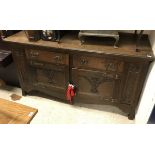 An oak sideboard in the Arts and Crafts manner