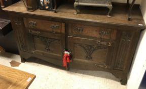 An oak sideboard in the Arts and Crafts manner