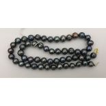 A Tahitian pearl necklace, approx 22" long,