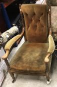 An Edwardian mahogany and satinwood banded button back open armchair on turned and fluted front