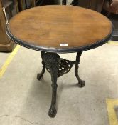 A pair of cast iron pub tables