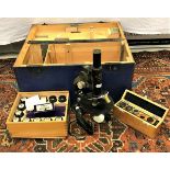 An Ernst Leitz monocular microscope together with various accessories