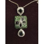 An 18 carat white gold designer pendant, set with white diamond,