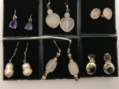Six pairs of various silver mounted stone set earrings to include rose quartz,