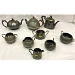 A quantity of various pewter and metal wares to include Tudric beaten pewter three piece tea set