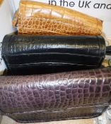 Three various leather Osprey handbags, one black,
