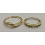 Two 18 carat gold and diamond set dress rings,