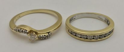Two 18 carat gold and diamond set dress rings,