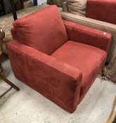 A modern red suede effect covered armchair and ottoman stool by Industrie Natuzzi