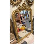 A Victorian giltwood and gesso framed overmantel mirror in the rococo taste CONDITION