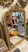 A Victorian giltwood and gesso framed overmantel mirror in the rococo taste CONDITION