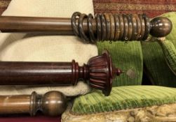 A collection of five various wooden curtain poles and rings,