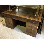 A 20th Century mahogany partner's desk,