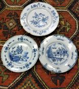 A collection of three 19th Century Dutch Delft floral decorated plates,