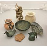 A collection of various ornaments in the Ancient style including a verdigris patinated miniature