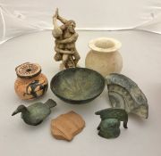 A collection of various ornaments in the Ancient style including a verdigris patinated miniature