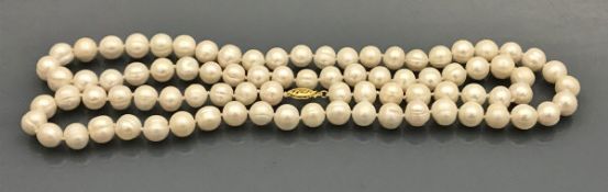 A South Seas white pearl necklace, approx 34" long,