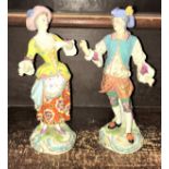 A pair of late 18th Century Derby type soft paste porcelain figures of a lady and gentleman,