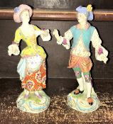 A pair of late 18th Century Derby type soft paste porcelain figures of a lady and gentleman,