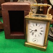 A circa 1900 French brass cased carriage clock with alarm,
