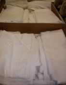 Two boxes of mainly white bed linens to include pillow cases, flat sheets, top sheets,