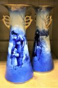 A pair of Royal Doulton "Blue Children" tapered vases