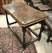 A 19th Century small oak refectory table with replacement top