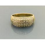 A 9 carat gold multi-diamond set dress ring, approx 4.