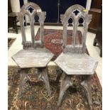 A pair of Victorian Gothic revival style limed oak panel seated hall chairs