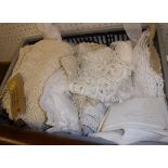 A box of assorted table linen together with various vintage lace collars, sections,
