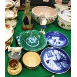 A Poole Pottery fruit bowl with floral decoration, two green leaf dishes,