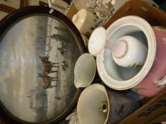 A box containing various toilet jugs and a pair of brass candlesticks,