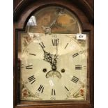 An oak cased long case clock of slim proportions,