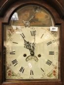 An oak cased long case clock of slim proportions,