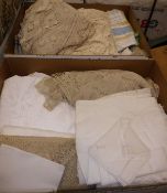 Two boxes of assorted table linens to include crochet and lace work tablecloths, napkins,