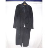 A ladies black wool coat bearing Harrods retail label, together with a collection of clothing,