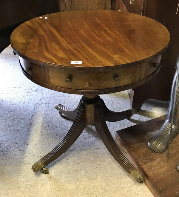 A mahogany drum table in the Regency style,