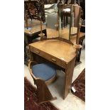 An early 20th Century Arts and Crafts style oak dressing table of small proportions,