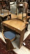 An early 20th Century Arts and Crafts style oak dressing table of small proportions,