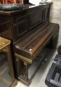 An early 20th Century mahogany cased upright piano,